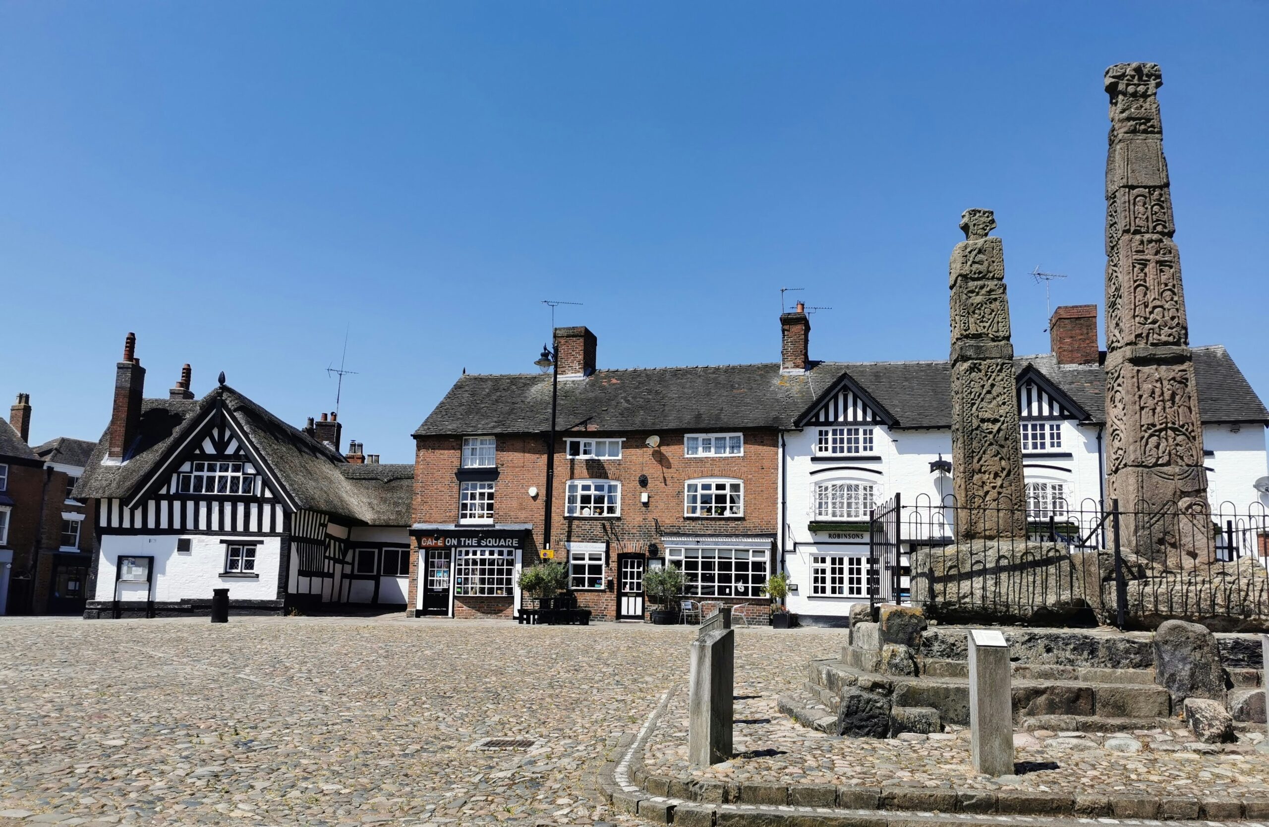 Sandbach village cobbled street and monument